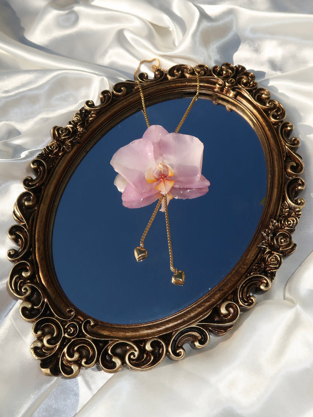 Pulling at My Heartstrings Orchid Necklace