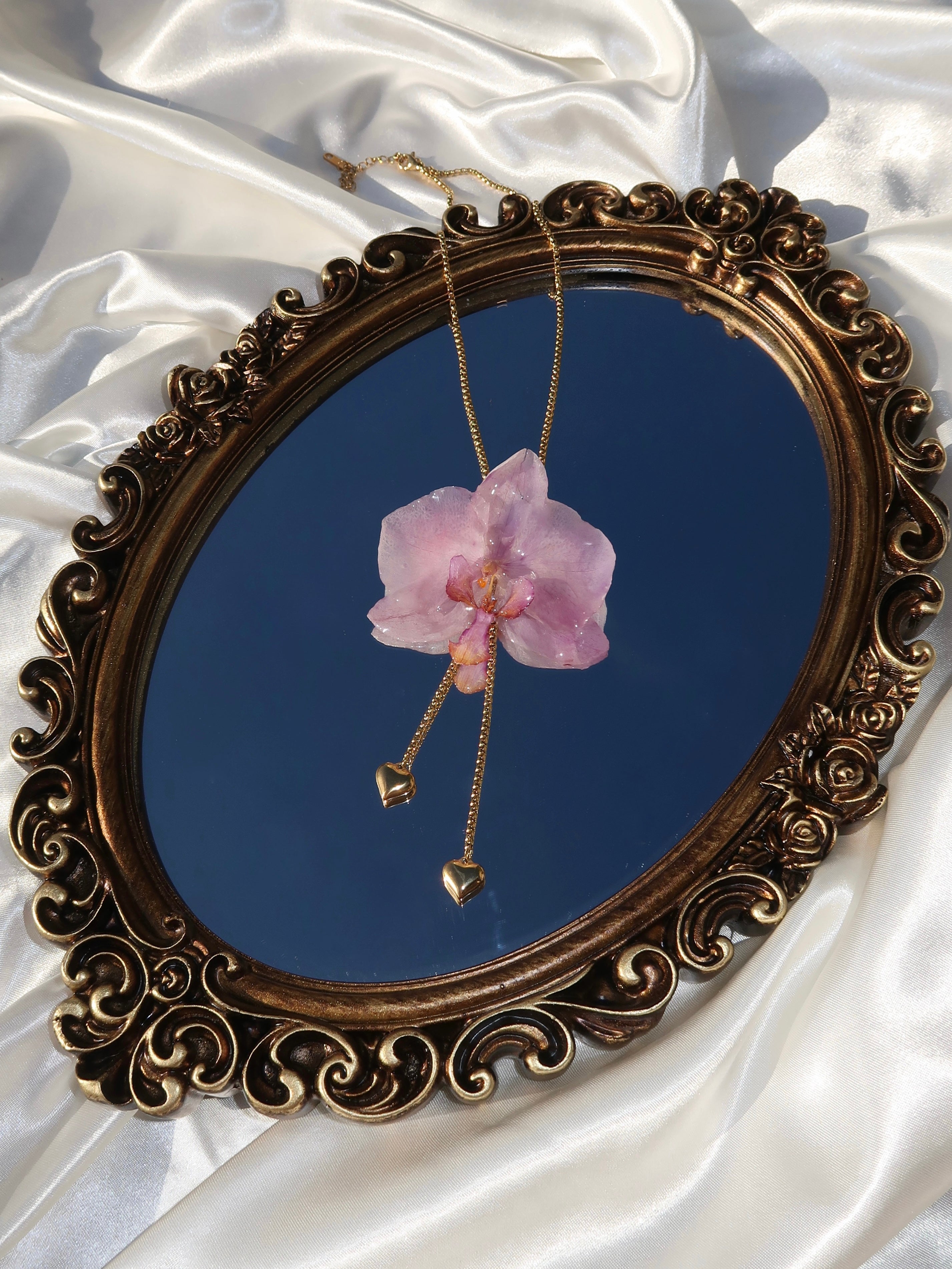 Pulling at My Heartstrings Orchid Necklace