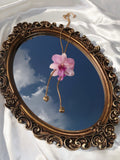 Pulling at My Heartstrings Orchid Necklace