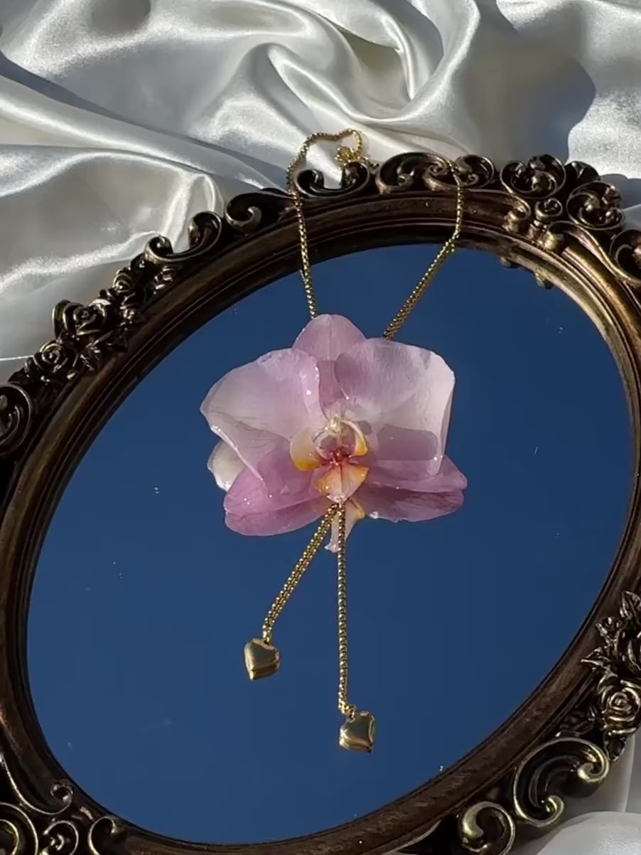 Pulling at My Heartstrings Orchid Necklace